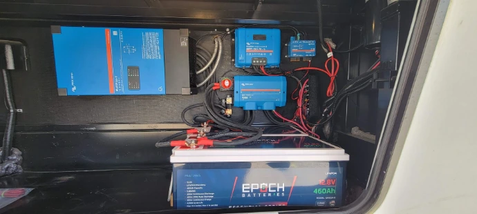 A solar + inverter + epoch battery installation in the front compartment of a fifth wheel.