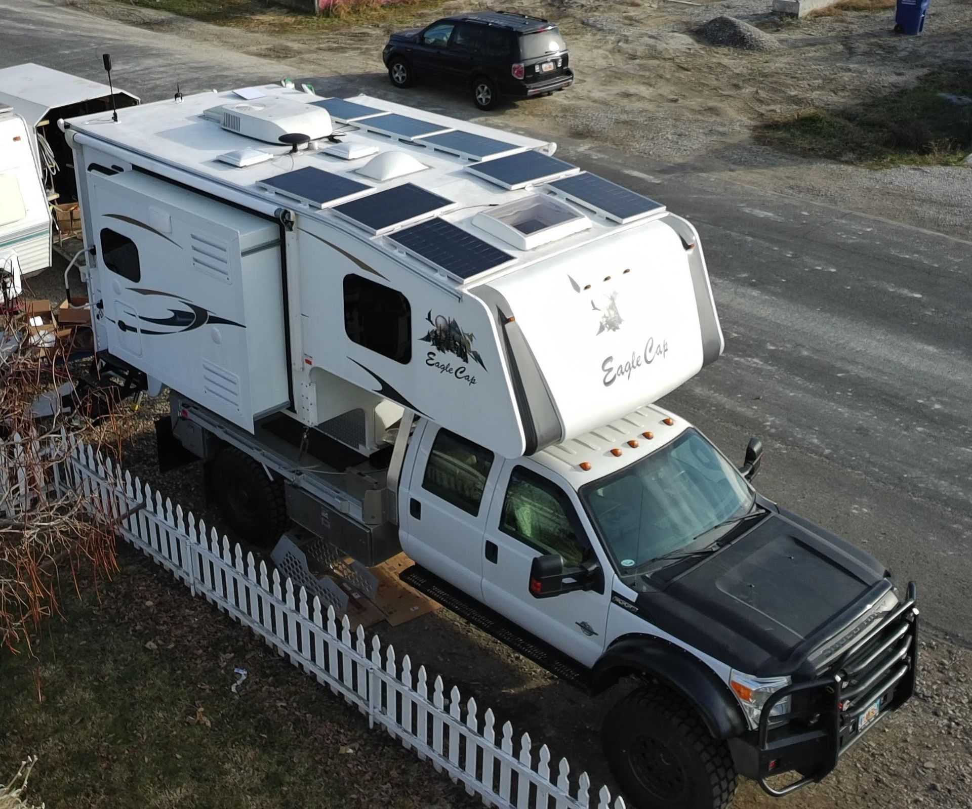 A Truck Bed camper with a solar system installed on the roof by Momentum Upfitters